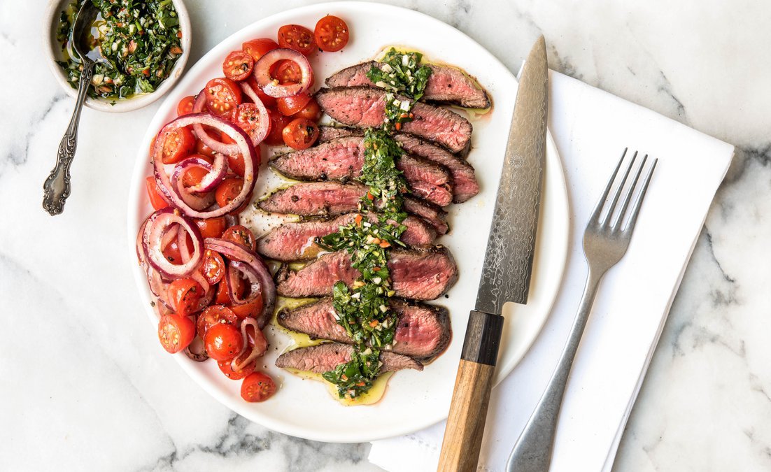 The hearty grilled steak with the bright flavors of chimichurri sauce and grape tomatoes will wake up your taste buds and make you forget all about the usual carb-filled steak sidekicks